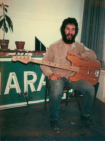 Megas-with-his-first-instrument-a-left-handed-bass-San-Francisco-1975
